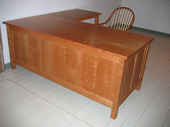 cherry paneled desk with return