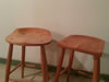 Seat comparison: tractor seat stool left, grain shovel stool right.