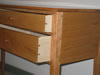 Dovetailed drawers, pinned mortise and tenon joints.